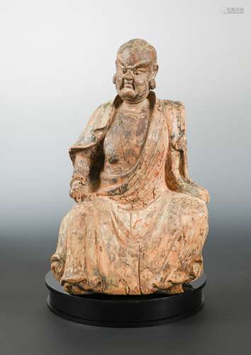 A Chinese carved & polychrome wood figure of a seated dignitary or immortal,