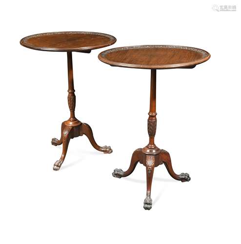 A pair of George III style mahogany tripod occasional tables,