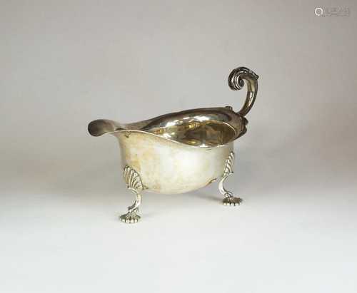 A Harrods silver sauce boat