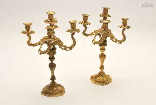 A pair of 19th century Rococo style, gilt bronze five branch candelabrum, pierced and moulded