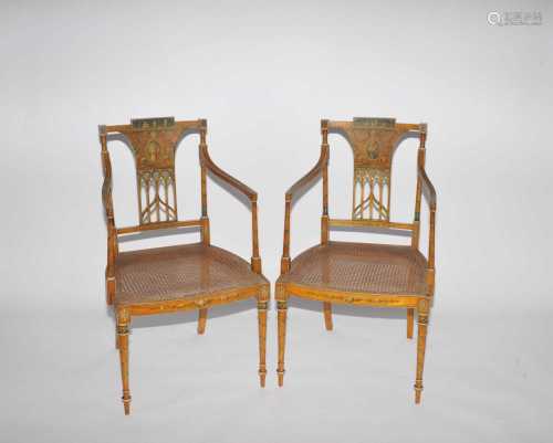 A pair of George III style painted satin birch elbow chairs, circa 1900, decorated in the Adam style