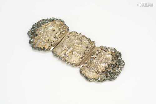 A Chinese or South East Asian silver belt buckle, early 20th century
