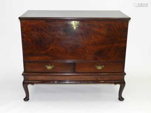 A good George II, solid mahogany, mule chest on stand, with re-entrant corners on the moulded