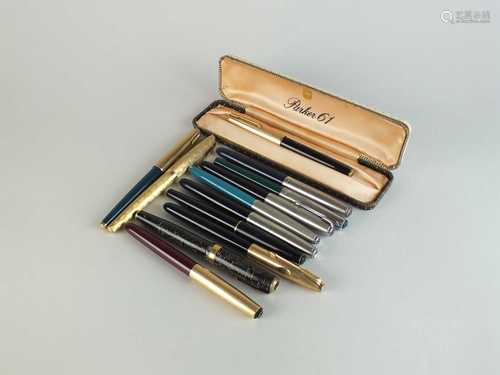 A collection of fountain pens, pens and pencils