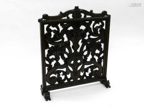 A late 19th century, Renaissance style, pitch pine and oak firescreen, carved and pierced with vases