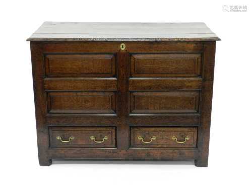 An 18th century oak mule chest, of Northern counties form, with 4 fielded panels above two working