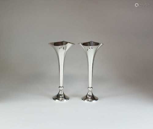 A pair of silver mounted posy vases