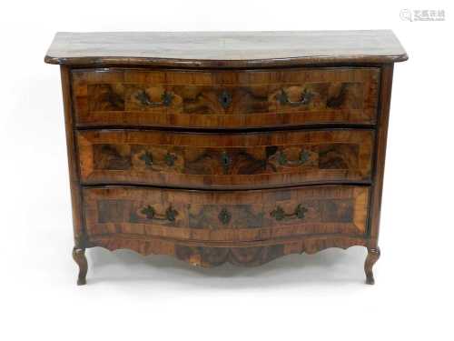 An 18th century, Italian, figured walnut veneered, serpentine three drawer commode, inlaid with