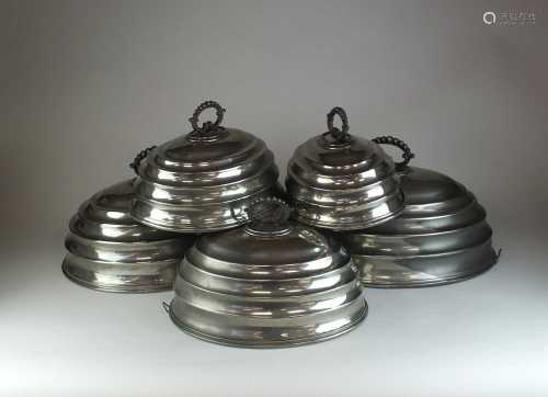 A set of five graduated silver plated meat covers