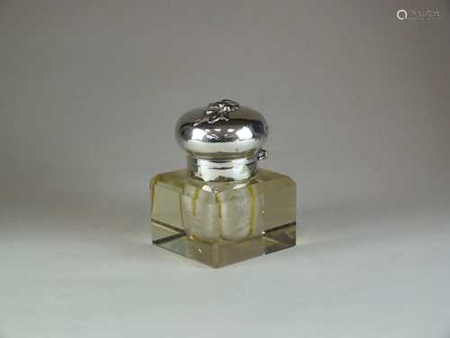 A white metal mounted cut glass inkwell