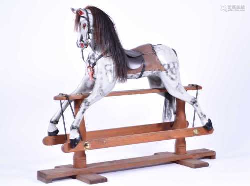 A large painted wood rocking horse