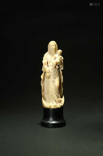 A French carved ivory figure of the Madonna and child, 19th century