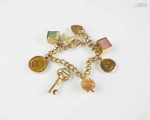 A 9ct gold curb link bracelet with attached charms