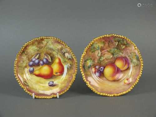 A pair of Royal Worcester fruit-decorated side plates