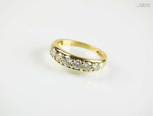 An 18ct yellow gold seven stone diamond ring