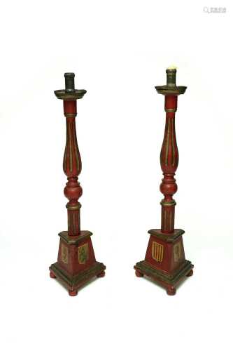 A pair of large Spanish painted wood candle holders
