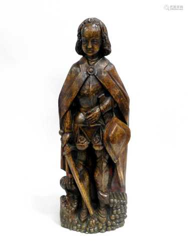 A Northern European carved oak figure of St.Michael,18th/19th century, modelled standing in armour