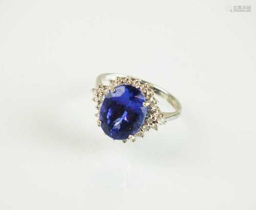 An 18ct white gold tanzanite and diamond cluster ring