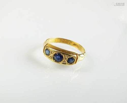 An Edwardian 18ct gold seven stone sapphire and diamond ring
