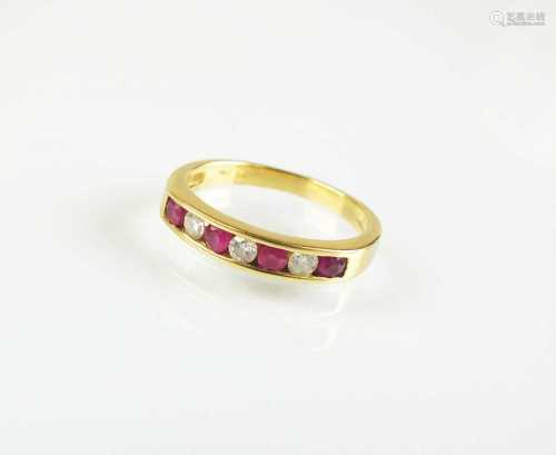 An 18ct gold seven stone ruby and diamond half eternity ring
