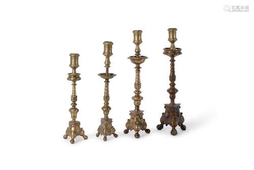 Four assorted Italian gilt bronze pricket altar sticks