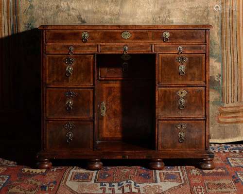 A William & Mary walnut and feather banded kneehole desk
