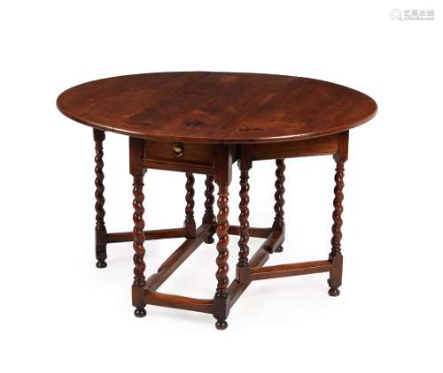 A William & Mary solid cedar gateleg dining table