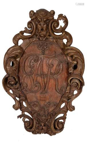 A Queen Anne carved pine armorial