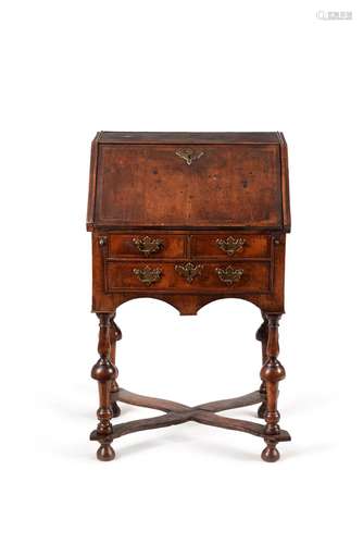 A William & Mary walnut and ash featherbanded bureau