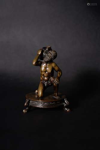 An Italian patinated bronze figural inkwell with Atlas supporting the globe