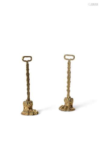 A pair of Regency brass door porters