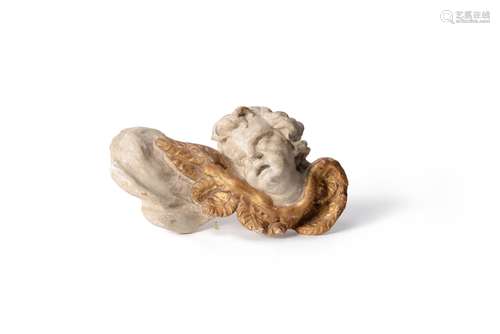 A Continental painted and giltwood wall mount modelled as a cherub's head