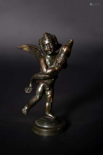 An Italian patinated bronze model of a putto with a dolphin after Andrea del Verrocchio (1435-1488)