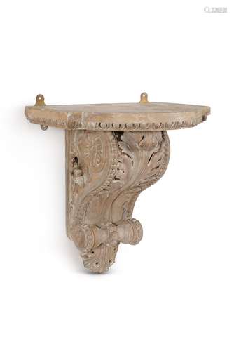 A carved pine architectural wall bracket