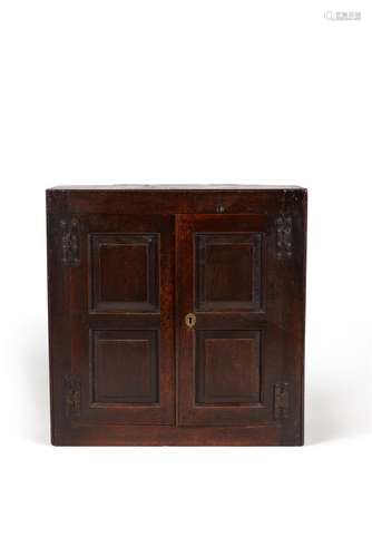 A George II oak and walnut hanging cupboard