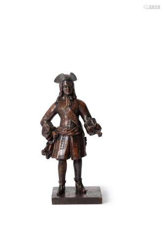 A rare sculpted oak model of a European merchant or army officer