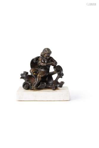 A gilt bronze model of a putto warming his hands