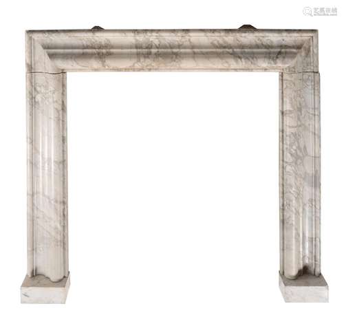 A variegated grey marble bolection moulded chimney piece