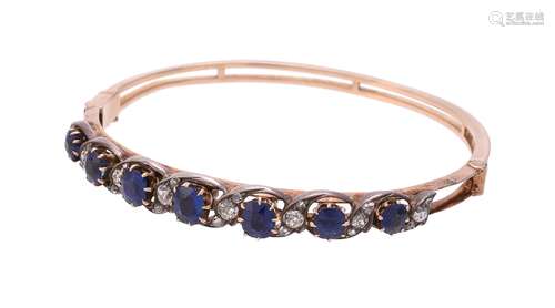 A late Victorian and later sapphire and diamond hinged bangle