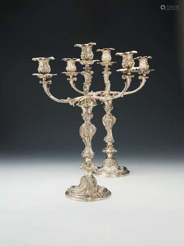 A pair of Victorian silver three light candelabra by Robert Garrard II