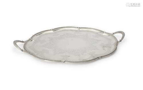 A Victorian silver shaped oval twin handled tray by Thomas Bradbury & Sons