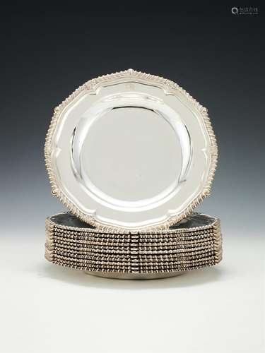 A set of twelve late George III silver hexafoil soup plates by Paul Storr