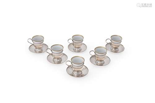 Cartier, a set of six plain silver and porcelain demitasse coffee cups and saucers