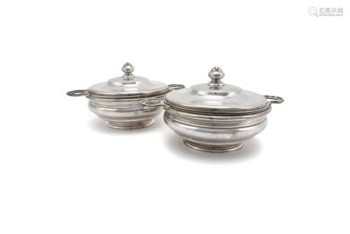 A pair of French silver circular vegetable dishes and covers by Gustave Keller