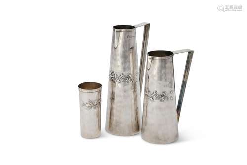 A graduated pair of Italian silver coloured straight tapered water jugs by Brandimarte