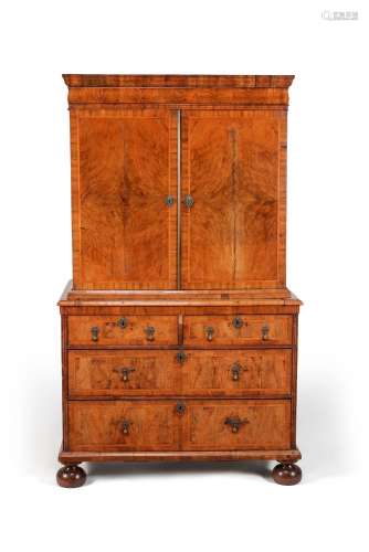 A Queen Anne walnut and feather banded cabinet on chest