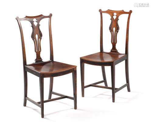 A pair of unusual George III fruitwood side chairs