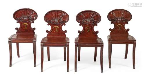 A set of four Regency mahogany hall chairs