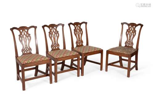 A set of four George III mahogany side chairs