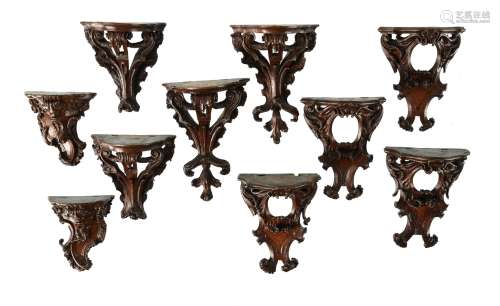 A companion set of ten unusual carved walnut miniature wall brackets